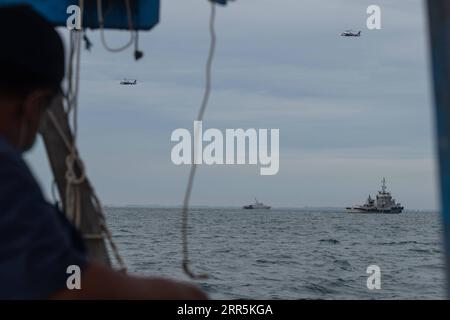 210110 -- LANCANG ISLAND, Jan. 10, 2021 -- The Joint Search and Rescue SAR team conducts a search operation at the plane crash site of the Sriwijaya Air flight SJ-182 in the waters of Lancang Island, Jan. 10, 2021. Indonesia s Transportation Minister Budi Karya Sumadi has confirmed the crash of a Boeing 737-500 plane of an Indonesian airlines with 62 people on board that lost contact with the air traffic controller on Saturday afternoon. At a virtual press conference held on Saturday evening, the minister said the Sriwijaya Air flight SJ-182 heading from capital city Jakarta to Pontianak city Stock Photo