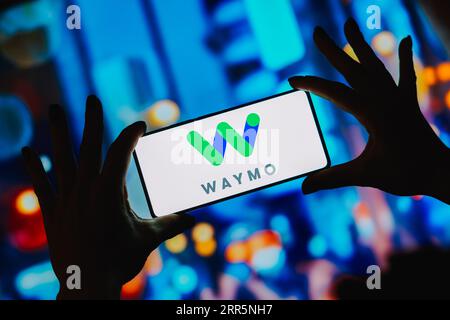 In this photo illustration, the Waymo logo is displayed on a smartphone ...