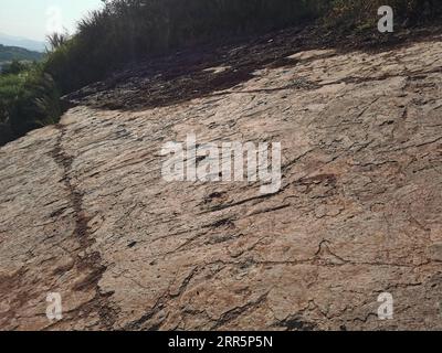210112 -- FUZHOU, Jan. 12, 2021  -- Dinosaur footprints are seen at Longxiang Village, Lincheng Township, Shanghang County, Longyan City of southeast China s Fujian Province, Nov. 9, 2020. A team of Chinese paleontologists has identified more than 240 fossilized dinosaur footprints in east China s Fujian, the first traces of dinosaur activity found in the province. The dinosaur track site in Shanghang County, covering an area of about 1,600 square meters, is the largest and the most diverse such site discovered in China dating back to the Upper Cretaceous period, according to scientists. The 8 Stock Photo