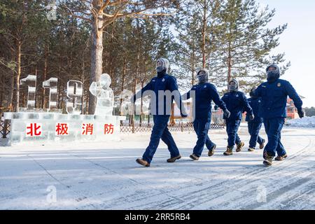 210114 -- MOHE, Jan. 14, 2021 -- Firefighters exercise at the fire station in Beiji Village of Mohe City, northeast China s Heilongjiang Province, Jan. 13, 2021. Firefighters stick to their post and keep training despite the freezing weather in Mohe, the northernmost city in China, where the temperature is often below minus 40 degrees Celsius in winter.  CHINA-HEILONGJIANG-MOHE-WINTER-FIRE FIGHTERSCN XiexJianfei PUBLICATIONxNOTxINxCHN Stock Photo