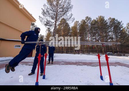 210114 -- MOHE, Jan. 14, 2021 -- Firefighters exercise at the fire station in Beiji Village of Mohe City, northeast China s Heilongjiang Province, Jan. 13, 2021. Firefighters stick to their post and keep training despite the freezing weather in Mohe, the northernmost city in China, where the temperature is often below minus 40 degrees Celsius in winter.  CHINA-HEILONGJIANG-MOHE-WINTER-FIRE FIGHTERSCN XiexJianfei PUBLICATIONxNOTxINxCHN Stock Photo