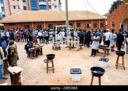 210114 -- KAMPALA, Jan. 14, 2021 -- People line up to cast their votes at a polling station in Najjera, Uganda, Jan. 14, 2021. Uganda s presidential and parliamentary elections kicked off on Thursday with people in the east African country queuing up to cast their votes. Photo by /Xinhua UGANDA-KAMPALA-ELECTION-VOTE HajarahxNalwadda PUBLICATIONxNOTxINxCHN Stock Photo