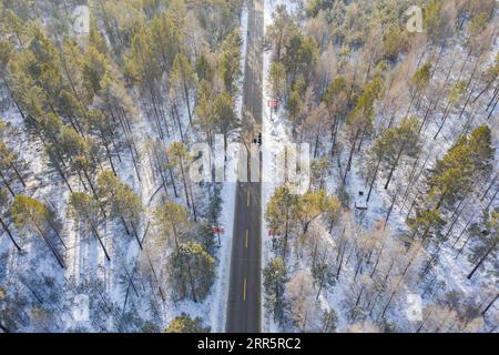 210114 -- MOHE, Jan. 14, 2021 -- Aerial photo shows firefighters exercising in Beiji Village of Mohe City, northeast China s Heilongjiang Province, Jan. 13, 2021. Firefighters stick to their post and keep training despite the freezing weather in Mohe, the northernmost city in China, where the temperature is often below minus 40 degrees Celsius in winter.  CHINA-HEILONGJIANG-MOHE-WINTER-FIRE FIGHTERSCN XiexJianfei PUBLICATIONxNOTxINxCHN Stock Photo