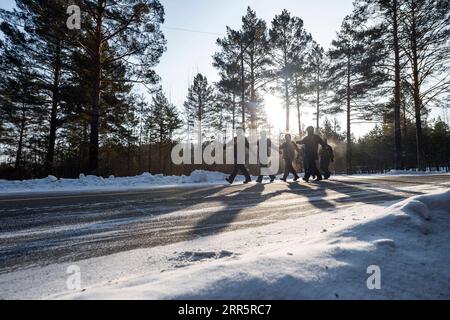 210114 -- MOHE, Jan. 14, 2021 -- Firefighters exercise in Beiji Village of Mohe City, northeast China s Heilongjiang Province, Jan. 13, 2021. Firefighters stick to their post and keep training despite the freezing weather in Mohe, the northernmost city in China, where the temperature is often below minus 40 degrees Celsius in winter.  CHINA-HEILONGJIANG-MOHE-WINTER-FIRE FIGHTERSCN XiexJianfei PUBLICATIONxNOTxINxCHN Stock Photo