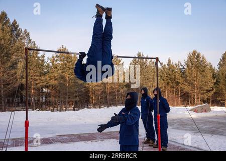 210114 -- MOHE, Jan. 14, 2021 -- Firefighters exercise at the fire station in Beiji Village of Mohe City, northeast China s Heilongjiang Province, Jan. 13, 2021. Firefighters stick to their post and keep training despite the freezing weather in Mohe, the northernmost city in China, where the temperature is often below minus 40 degrees Celsius in winter.  CHINA-HEILONGJIANG-MOHE-WINTER-FIRE FIGHTERSCN XiexJianfei PUBLICATIONxNOTxINxCHN Stock Photo