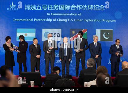 210118 -- BEIJING, Jan. 18, 2021 -- Commemorative plates are awarded to representatives from the international cooperators for the Chang e-5 lunar mission at the National Astronomical Observatories of China under the Chinese Academy of Sciences in Beijing, capital of China, Jan. 18, 2021. China on Monday unveiled regulations on lunar sample management, encouraging international cooperation on studying the samples brought back by the Chang e-5 probe. Released by the China National Space Administration CNSA, the regulations cover general principles for preserving, managing, using, borrowing and Stock Photo