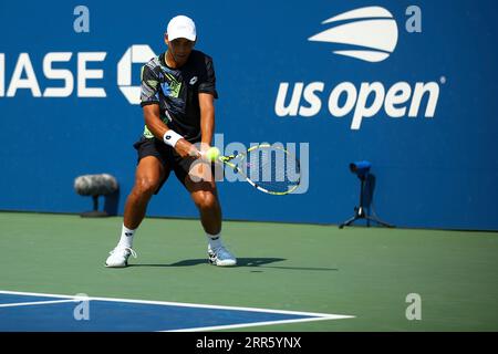 Fabio De Michele in action during a junior boys singles match at