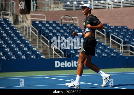 Fabio De Michele in action during a junior boys singles match at