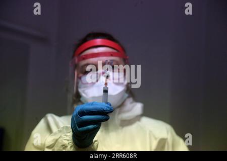 210120 -- ANKARA, Jan. 20, 2021 -- A health worker prepares a dose of COVID-19 vaccine at a nursing home in Ankara, Turkey, on Jan. 19, 2021. Turkey s vaccination campaign on Tuesday extended to the people staying and working in care and nursing homes and the citizens over 90. The state-run TRT news broadcaster released footage of the elderly and their caregivers getting their first doses of the COVID-19 vaccine developed by China s Sinovac at the nursing homes on Tuesday. The elderly over 90 also received their vaccines at home. Photo by /Xinhua TURKEY-ANKARA-COVID-19-VACCINATION MustafaxKaya Stock Photo
