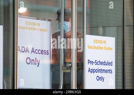 210124 -- NEW YORK, Jan. 24, 2021 -- A National Guard member stands at a COVID-19 vaccination center at the Jacob K. Javits Convention Center in New York, the United States, Jan. 23, 2021. The total number of confirmed COVID-19 cases in the United States topped 24.99 million, according to the data released by Johns Hopkins University on Saturday. Photo by /Xinhua U.S.-COVID-19-CONFIRMED CASES MichaelxNagle PUBLICATIONxNOTxINxCHN Stock Photo