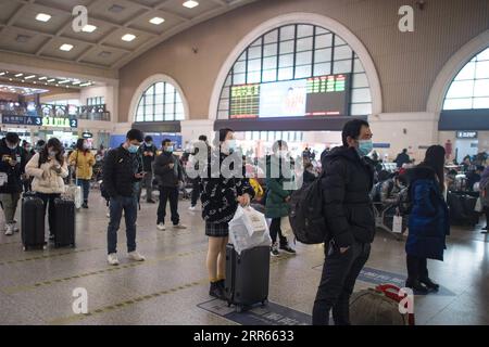 210128 -- BEIJING, Jan. 28, 2021 -- Passengers observe social distancing while waiting to check in at the Hankou Railway Station in Wuhan, capital of central China s Hubei Province, Jan. 28, 2021.  Xinhua Headlines: China expects less Spring Festival travel amid epidemic control XiaoxYijiu PUBLICATIONxNOTxINxCHN Stock Photo
