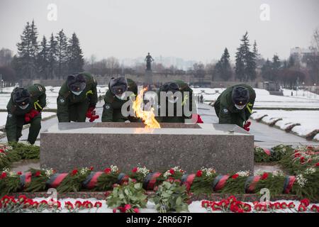 210128 -- ST. PETERSBURG, Jan. 28, 2021 -- Soldiers lay flowers at the Piskaryovskoye Memorial Cemetery in St. Petersburg, Russia, Jan. 27, 2021. Activities were held here to mark the 77th anniversary of ending the Nazi siege of Leningrad during World War II. Leningrad was besieged by the Nazi troops on Sept. 8, 1941 and the siege was lifted on Jan. 27, 1944. Photo by /Xinhua RUSSIA-ST. PETERSBURG-LENINGRAD BLOCKADE-ANNIVERSARY IrinaxMotina PUBLICATIONxNOTxINxCHN Stock Photo