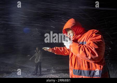 210131 -- URUMQI, Jan. 31, 2021 -- A staff member of the Maytas wind prevention and rescuing base dispatches rescue cars in Maytas, Emin County of northwest China s Xinjiang Uygur Autonomous Region, Jan. 22, 2021. Maytas, located in Emin County, is an important thoroughfare with tough weather conditions of snowstorms and heavy wind for about half a year. Since 2002, the Maytas wind prevention and rescuing base has been responsible for road clearing and rescuing of the S201 in the region. For people who are on duty here, work can last day and night. They patrol on every windy and snowy day, res Stock Photo