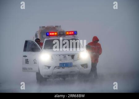 210131 -- URUMQI, Jan. 31, 2021 -- Staff of the Maytas wind prevention and rescuing base search for stranded passengers in Maytas, Emin County of northwest China s Xinjiang Uygur Autonomous Region, Jan. 23, 2021. Maytas, located in Emin County, is an important thoroughfare with tough weather conditions of snowstorms and heavy wind for about half a year. Since 2002, the Maytas wind prevention and rescuing base has been responsible for road clearing and rescuing of the S201 in the region. For people who are on duty here, work can last day and night. They patrol on every windy and snowy day, resc Stock Photo