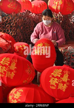 https://l450v.alamy.com/450v/2rr6bnp/210204-taiyuan-feb-4-2021-a-worker-makes-red-lanterns-at-a-lantern-workshop-in-yangzhao-village-of-jishan-county-yuncheng-north-china-s-shanxi-province-feb-4-2021-lantern-workshops-in-yangzhao-village-are-trying-their-best-to-fulfill-rush-orders-placed-ahead-of-the-chinese-lunar-new-year-which-falls-on-feb-12-this-year-china-shanxi-spring-festival-lantern-workshop-cn-maxyimin-publicationxnotxinxchn-2rr6bnp.jpg