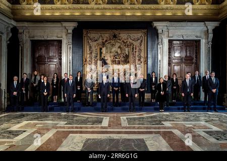 210213 -- ROME, Feb. 13, 2021 -- Italian President Sergio Mattarella 4th L, front and Prime Minister Mario Draghi 5th L, front pose for a group photo with other members of the new government at the Quirinal presidential palace in Rome, Italy, Feb. 13, 2021. The Italian government formed by newly-appointed Prime Minister Mario Draghi, who was the former chief of the European Central Bank ECB, was officially sworn in on Saturday.  ITALY-ROME-NEW PM-CABINET PoolxviaxXinhua PUBLICATIONxNOTxINxCHN Stock Photo