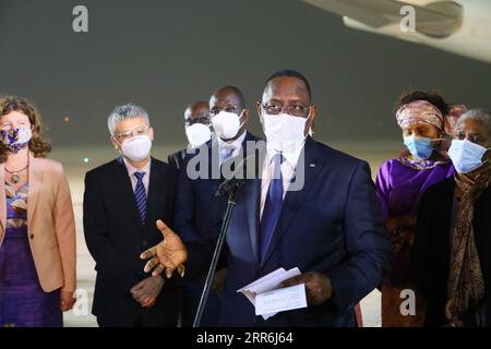 210218 -- DAKAR, Feb. 18, 2021 -- Senegalese President Macky Sall front speaks during the delivery ceremony of the first batch of China s Sinopharm COVID-19 vaccine at Blaise Diagne International Airport in Dakar, Senegal, Feb. 17, 2021. Senegal on Wednesday night received the first batch of China s Sinopharm COVID-19 vaccine.  SENEGAL-DAKAR-CHINESE COVID-19 VACCINE-ARRIVAL XingxJianqiao PUBLICATIONxNOTxINxCHN Stock Photo
