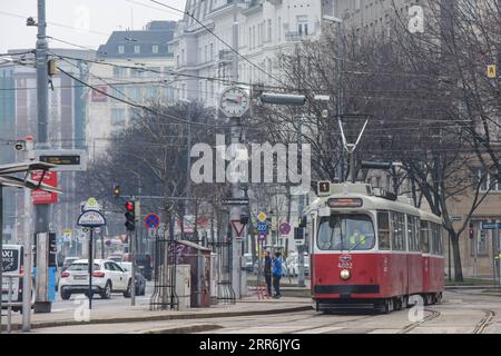 210219 -- VIENNA, Feb. 19, 2021 -- A tram drives across the street in Vienna, Austria, Feb. 19, 2021. Around 574 million passengers traveled by underground, tram and bus in Vienna in 2020, which is 40 percent fewer than in 2019, according to the public transport operator Wiener Linien.  AUSTRIA-VIENNA-PUBLIC TRANSPORTATION-DECREASING GuoxChen PUBLICATIONxNOTxINxCHN Stock Photo