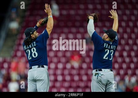 Seattle Mariners' Eugenio Suarez holds a trident as he celebrates