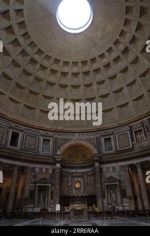 210226 -- ROME, Feb. 26, 2021 -- People visit the Pantheon in Rome, Italy, Feb. 25, 2021. With the easing of coronavirus restrictions, museums and cultural sites reopened from Feb. 1 in most of Italy with new health-monitoring protocols. The only thing missing were the tourists. There were multiple factors behind the low visitor numbers, according to media reports, ranging from economic hardship to health worries to the fact that tickets have to be bought ahead of time online. But the biggest factor was clearly the lack of tourists due to coronavirus fears and international travel restrictions Stock Photo