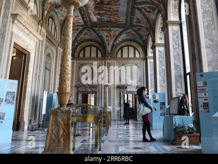 210226 -- ROME, Feb. 26, 2021 -- People wearing face masks visit the Villa Farnesina in Rome, Italy, Feb. 25, 2021. With the easing of coronavirus restrictions, museums and cultural sites reopened from Feb. 1 in most of Italy with new health-monitoring protocols. The only thing missing were the tourists. There were multiple factors behind the low visitor numbers, according to media reports, ranging from economic hardship to health worries to the fact that tickets have to be bought ahead of time online. But the biggest factor was clearly the lack of tourists due to coronavirus fears and interna Stock Photo