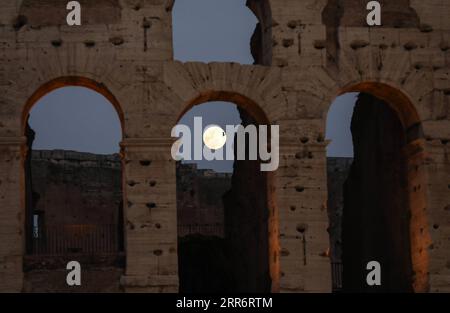 210226 -- ROME, Feb. 26, 2021 -- Photo taken on Feb. 26, 2021 shows the full moon above the Colosseum in Rome, Italy. The Chinese Lantern Festival falls on Friday this year.  ITALY-ROME-LANTERN FESTIVAL-FULL MOON ChengxTingting PUBLICATIONxNOTxINxCHN Stock Photo