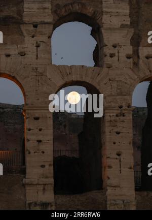 210226 -- ROME, Feb. 26, 2021 -- Photo taken on Feb. 26, 2021 shows the full moon above the Colosseum in Rome, Italy. The Chinese Lantern Festival falls on Friday this year.  ITALY-ROME-LANTERN FESTIVAL-FULL MOON ChengxTingting PUBLICATIONxNOTxINxCHN Stock Photo