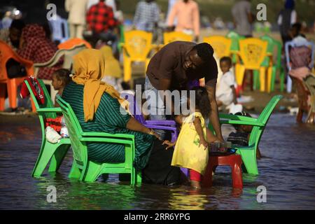 210305 -- KHARTOUM, March 5, 2021 -- People enjoy their weekend in the water of the Blue Nile in Khartoum, Sudan, March 5, 2021. Photo by /Xinhua SUDAN-KHARTOUM-DAILY LIFE-WEEKEND MohamedxKhidir PUBLICATIONxNOTxINxCHN Stock Photo