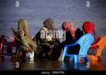 210305 -- KHARTOUM, March 5, 2021 -- People enjoy their weekend in the water of the Blue Nile in Khartoum, Sudan, March 5, 2021. Photo by /Xinhua SUDAN-KHARTOUM-DAILY LIFE-WEEKEND MohamedxKhidir PUBLICATIONxNOTxINxCHN Stock Photo