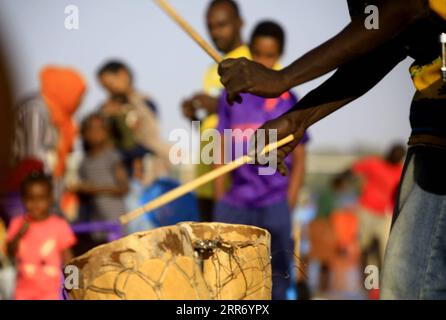 210305 -- KHARTOUM, March 5, 2021 -- People paly music on a beach of the Blue Nile during the weekend in Khartoum, Sudan, March 5, 2021. Photo by /Xinhua SUDAN-KHARTOUM-DAILY LIFE-WEEKEND MohamedxKhidir PUBLICATIONxNOTxINxCHN Stock Photo