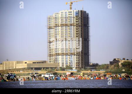 210305 -- KHARTOUM, March 5, 2021 -- People enjoy their weekend in the water and on the beach of the Blue Nile in Khartoum, Sudan, March 5, 2021. Photo by /Xinhua SUDAN-KHARTOUM-DAILY LIFE-WEEKEND MohamedxKhidir PUBLICATIONxNOTxINxCHN Stock Photo