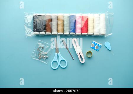 Tools and accessories for sewing on color background  Stock Photo