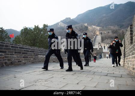 210307 -- BEIJING, March 7, 2021 -- Members of the female police force of Badaling Police Station patrol on the Badaling Great Wall in Beijing, capital of China, March 7, 2021. Established in 2018, the female police force of Badaling Police Station of Yanqing Branch of Beijing Municipal Public Security Bureau consists of 6 members with an average age of 33. In terms of daily work, the policewomen patrol in the world-renowned scenic area to keep order and public security, and help tourists to settle issues. Known for kind, patient and meticulous, the policewomen has become the iconic scenery, a Stock Photo