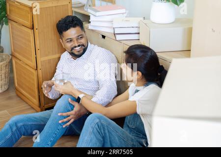 Married couple moving in new property bought together on mortgage loan Stock Photo