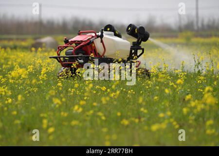 210317 -- BEIJING, March 17, 2021 -- An unmanned crop protection machine works in the fields of the Datian rural cooperative in Jiangxiang Town, Nanchang County of east China s Jiangxi Province, March 12, 2021.  Xinhua Headlines: China s spring farming goes high-tech to ensure food security PengxZhaozhi PUBLICATIONxNOTxINxCHN Stock Photo