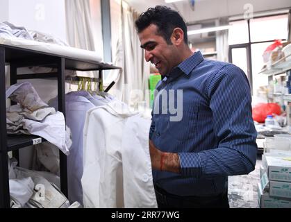 210318 -- XI AN, March 18, 2021 -- Abdul Ghaffar Shar makes preparation for an experiment at a laboratory of Northwest Agriculture and Forestry University NWAFU in Yangling, northwest China s Shaanxi Province, March 17, 2021. Abdul Ghaffar Shar, 30, is a Pakistani doctoral student in China s Northwest Agriculture and Forestry University NWAFU. Shar is doing plant nutrition research for his doctoral degree. After receiving his bachelor s degree in agriculture from Sindh Agriculture University in Pakistan in 2014, Shar decided to further his studies in China s NWAFU. Shar has learned to speak Ma Stock Photo