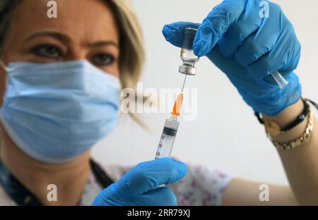 210323 -- ANKARA, March 23, 2021 -- A nurse prepares a dose of COVID-19 vaccine in Ankara, Turkey, on March 22, 2021. Turkey on Monday reported 22,216 new COVID-19 cases, including 981 symptomatic patients, raising the total number in the country to 3,035,338, according to its health ministry. The death toll from the virus in Turkey rose by 117 to 30,178, while the total recoveries climbed to 2,844,681 after 19,494 more cases recovered in the last 24 hours. Photo by /Xinhua TURKEY-ANKARA-COVID-19-VACCINATION MustafaxKaya PUBLICATIONxNOTxINxCHN Stock Photo
