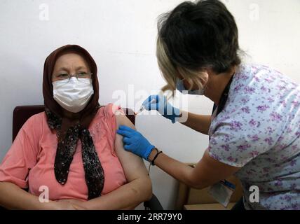 210323 -- ANKARA, March 23, 2021 -- A woman wearing a mask receives vaccination in Ankara, Turkey, on March 22, 2021. Turkey on Monday reported 22,216 new COVID-19 cases, including 981 symptomatic patients, raising the total number in the country to 3,035,338, according to its health ministry. The death toll from the virus in Turkey rose by 117 to 30,178, while the total recoveries climbed to 2,844,681 after 19,494 more cases recovered in the last 24 hours. Photo by /Xinhua TURKEY-ANKARA-COVID-19-VACCINATION MustafaxKaya PUBLICATIONxNOTxINxCHN Stock Photo
