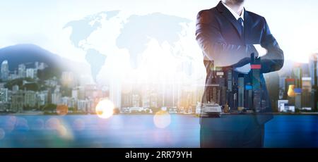 Portrait of businessman .Double exposure effect with Hong Kong city skyline business center view at sunrise . Stock Photo