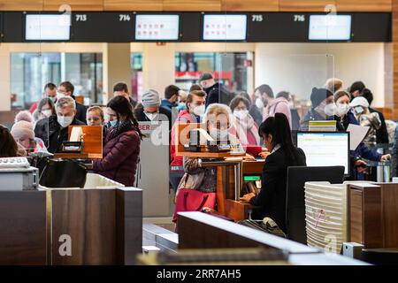 210324 -- BERLIN, March 24, 2021 -- Passengers check in at Berlin Brandenburg Airport in Schoenefeld, Germany, March 23, 2021. Germany will extend its COVID-19 lockdown till at least April 18 with even stricter restrictions during the Easter holidays, Chancellor Angela Merkel announced at a press conference in the early hours of Tuesday. Photo by /Xinhua GERMANY-BERLIN-COVID-19-AIRPORT-STRICTER RESTRICTIONS StefanxZeitz PUBLICATIONxNOTxINxCHN Stock Photo