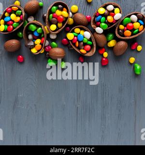 Chocolate eggs with colorful candies Stock Photo