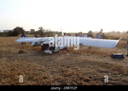 210327 -- BHOPAL INDIA, March 27, 2021 -- People work at the crash site of a trainer aircraft near Bhopal, the capital city of the state of Madhya Pradesh, central India, on March 27, 2021. Three pilots were injured after their aircraft crashed here Saturday, local media reports said. Str/Xinhua INDIA-BHOPAL-TRAINER AIRCRAFT-CRASH Stringer PUBLICATIONxNOTxINxCHN Stock Photo