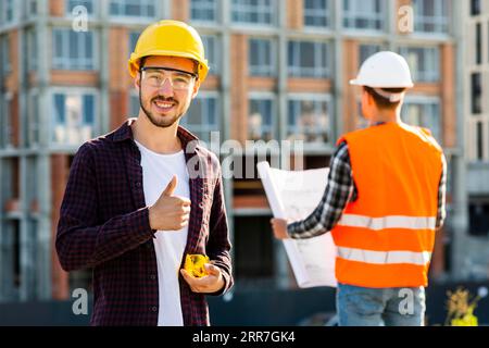 Medium shot portrait smiling architect looking camera Stock Photo