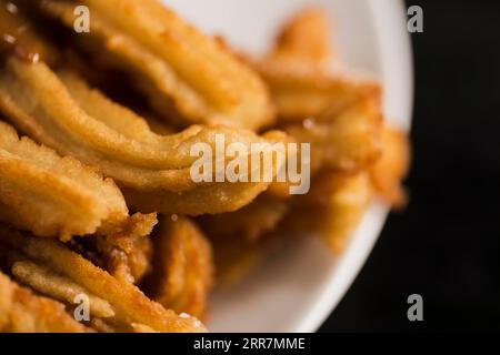 High view fried churros plate Stock Photo