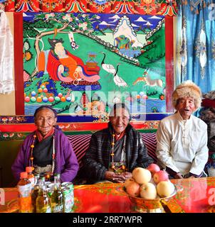 210406 -- LHASA, April 6, 2021 -- Dacho C and her family members pose for a photo at home in Lalho Township, Saga County of Xigaze, southwest China s Tibet Autonomous Region, Jan. 14, 2021. Dacho, born in 1929, is a resident in Lalho Township, Saga County of Xigaze, southwest China s Tibet Autonomous Region. She was made a serf in her early childhood and had suffered an unimaginable ordeal until the democratic reform in 1959. The serf owner kept a roster listing dates of birth of all local residents, who would be made serfs at certain age, regardless of gender or health condition, Dacho recall Stock Photo