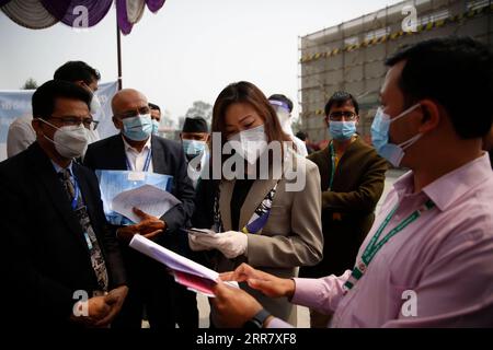 210407 -- KATHMANDU, April 7, 2021 -- Chinese Ambassador to Nepal Hou Yanqi C discusses vaccination with local officials at a hospital in Kathmandu, Nepal on April 7, 2021. Nepal on Wednesday started administering the COVID-19 vaccines donated by China amid resurging COVID-19 cases.  NEPAL-KATHMANDU-COVID-19-VACCINE SulavxShrestha PUBLICATIONxNOTxINxCHN Stock Photo