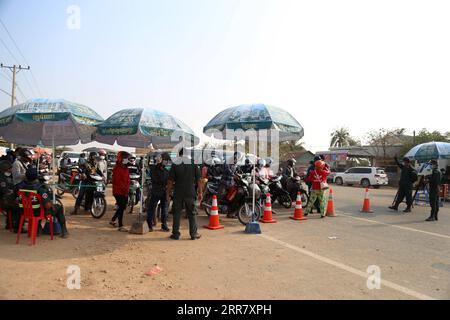 210407 -- PHNOM PENH, April 7, 2021 -- Police block a road on the border of Kampong Speu province and Kandal province in Cambodia to prevent inter-provincial travel on April 7, 2021. A 14-day ban on travel between provinces started in Cambodia on Wednesday in a bid to stem the spread of COVID-19. The move came after the kingdom saw a rise in daily COVID-19 cases recently. By Tuesday, Cambodia had reported 2,824 confirmed cases of COVID-19 with 22 fatalities and 1,794 recoveries, according to the Ministry of Health. Photo by /Xinhua CAMBODIA-PHNOM PENH-COVID-19-TRAVEL RESTRICTION LyxLay PUBLICA Stock Photo