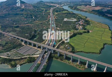 210415 -- HAIKOU, April 15, 2021 -- Aerial photo taken on Dec. 30, 2020 shows a view of a section of Wuzhishan-Haitangwan Expressway in south China s Hainan Province. Hainan has made significant progress in the construction of expressway since the 13th Five-Year Plan, which started in 2016. By far, the total mileage of expressways in the province has reached 1,255 kilometers. The transport upgrade will help boost the building of Hainan into an international tourism and consumption center.  CHINA-HAINAN-EXPRESSWAY-AERIAL VIEWS CN GuoxCheng PUBLICATIONxNOTxINxCHN Stock Photo