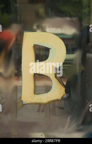 Old worn letter B, showing its age, pattern, lines and boldly grabbing attention.  Be noticed with this single letter, Stock Photo