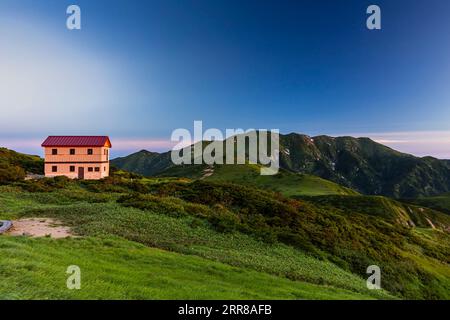 Asahi Mountain Range, morning glow, Kitsuneana shelter hut and Mt.Itoh(Itohdake),100 mountains of Japan, Yamagata, Tohoku, Japan, Asia Stock Photo